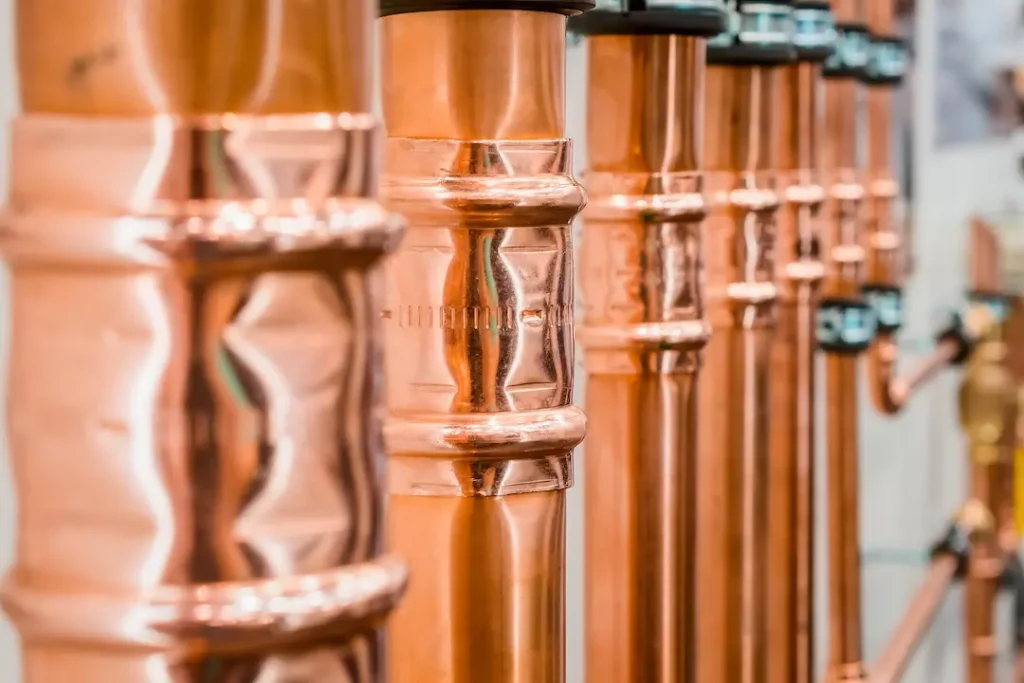 a close up of copper pipes