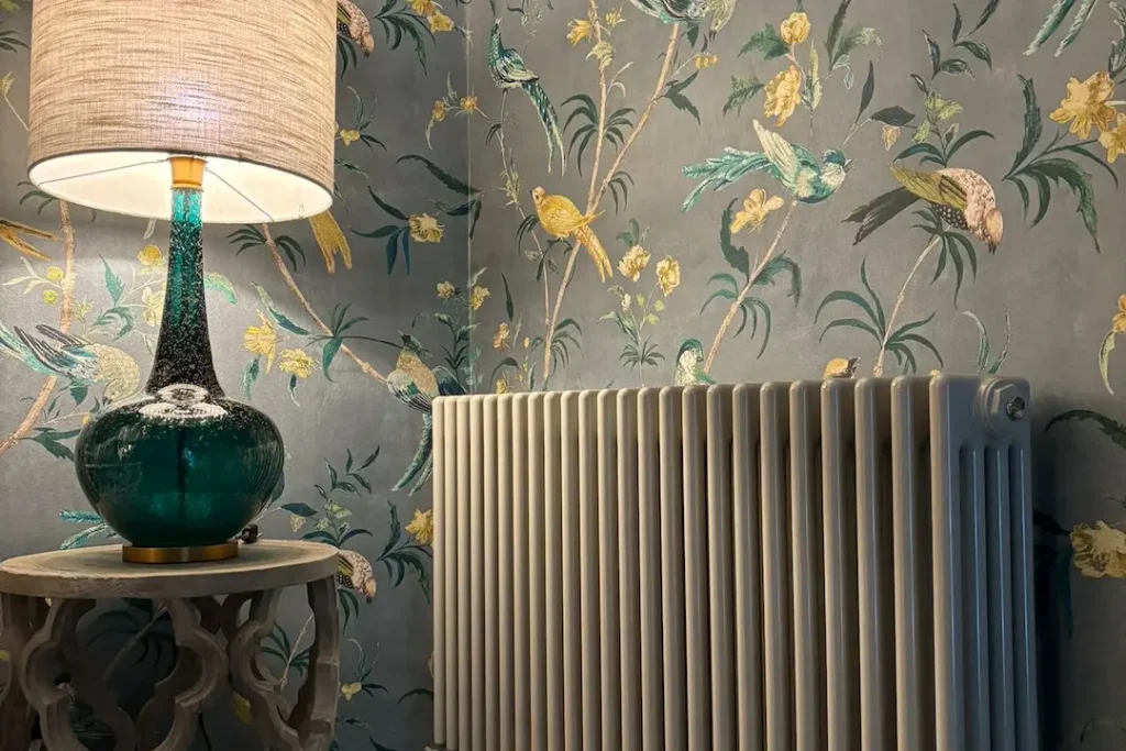 a lamp on a table next to a radiator